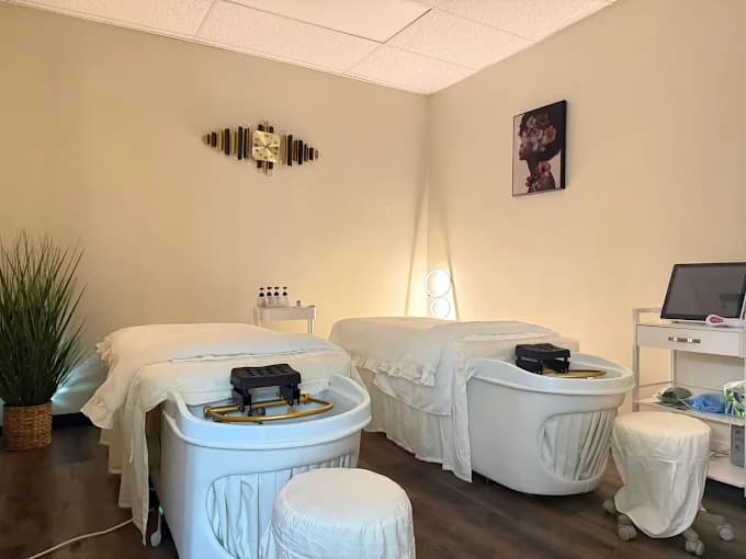 Treatment room with massage and head spa beds at Natural Beauty Spa
